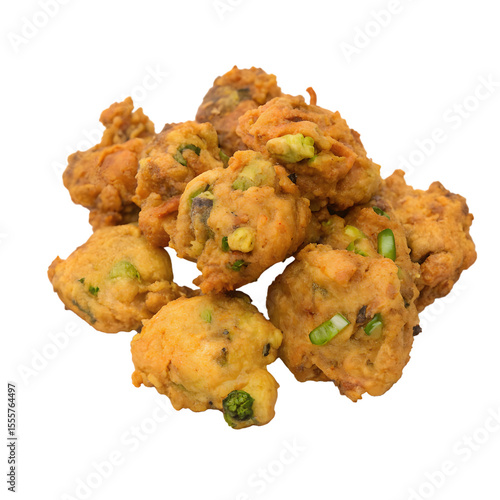Pile of golden brown pakora fritters with green onions isolated on transparent background