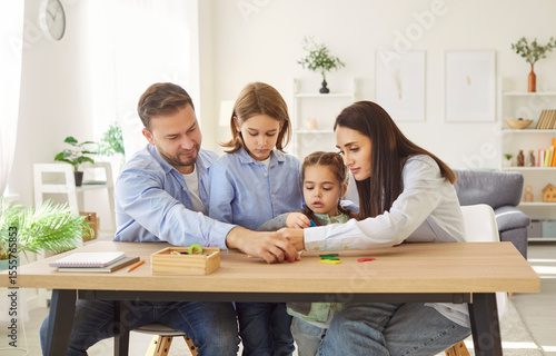 Fotografia Happy family fun, parents and cute little preschool kid girl, boy using developi