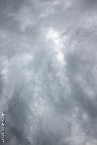 sky filled with dense, gray clouds. The clouds exhibit varying shades of gray and have a textured, layered appearance.