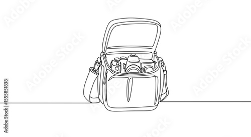 Open camera bag with equipment on a table for International Photographer Day  