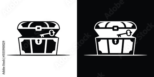 Black and White of an Open Treasure Chest with a Key on Top