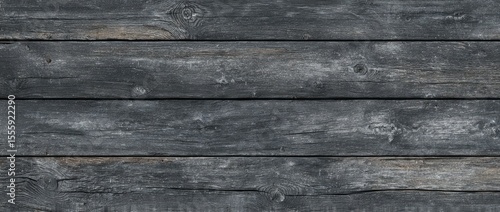 Dark gray weathered wood planks, horizontally arranged, showing grain and texture