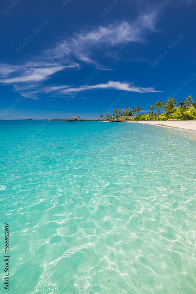 Fototapeta premium Idyllic Maldives tropical resort beach with palm trees, white sand, sunny blue sky, peaceful nature landscape, perfect paradise island for summer vacation, travel, relaxation, and tropical getaway