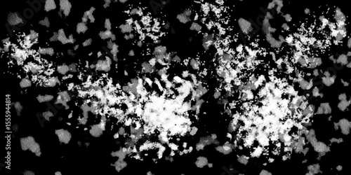 Snowflakes on dark background. white icy snowflakes isolated on black background, natural background. white crystalline powder on a black background. sugar dust. texture, pattern and clipping.