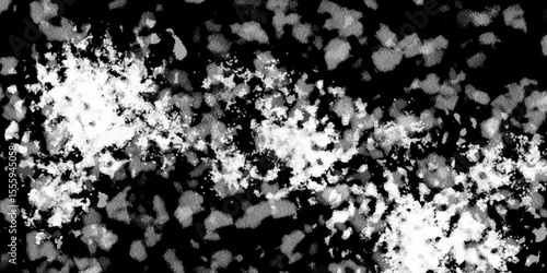 Snowflakes on dark background. white icy snowflakes isolated on black background, natural background. white crystalline powder on a black background. sugar dust. texture, pattern and clipping.