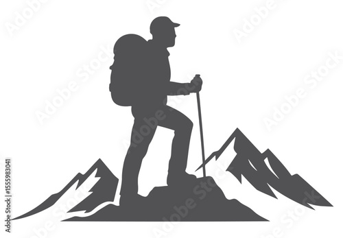Silhouette of hiker with backpack and pole on mountain peak