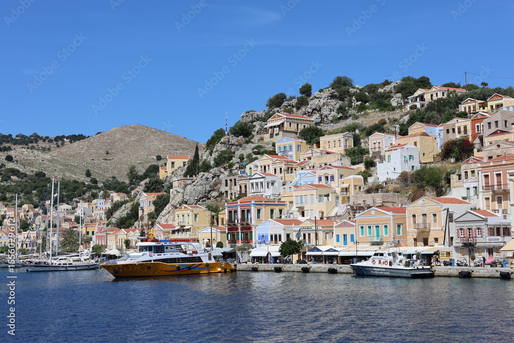 Fototapeta premium Colorful Coastal Houses of Symi Island, Greece – Mediterranean Architecture