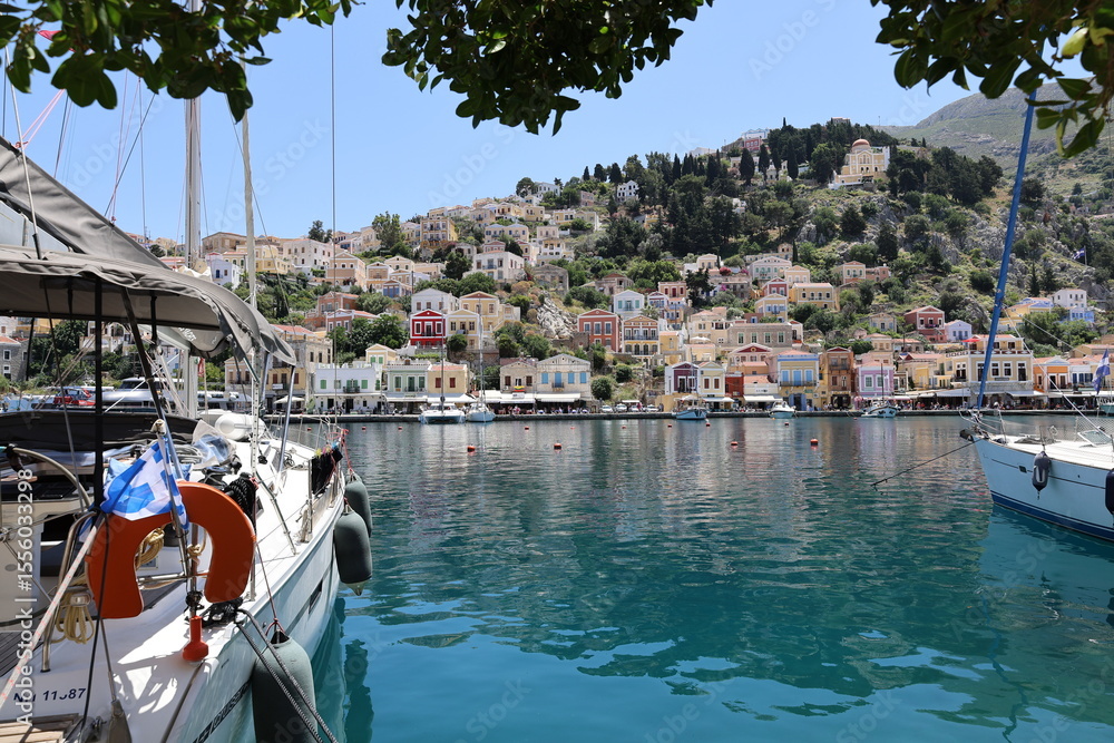 Obraz premium Mediterranean Beauty – Brightly Colored Houses on Symi Island, Greece