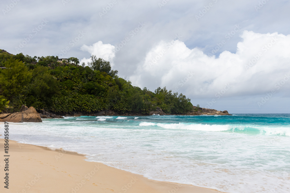 Mahe island, Seychelles. Tropical beach scene showcasing golden sand Mahe island, Seychelles. Tropical beach scene showcasing golden sand