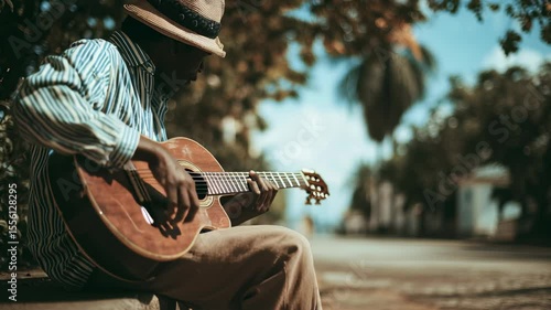 Man Plays Acoustic Guitar Outdoors in Golden Hour