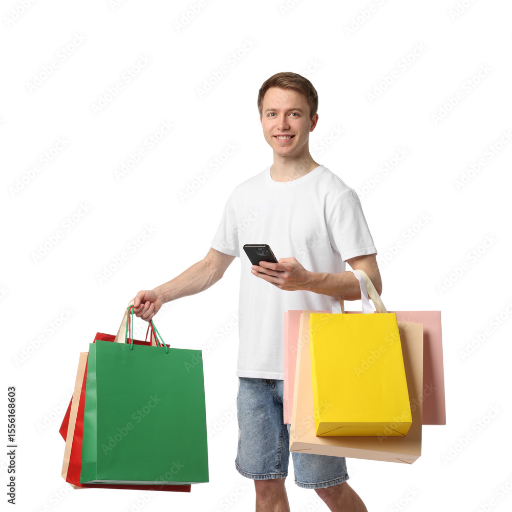 Cheerful man with smartphone and shopping bags on white background Cheerful man with smartphone and shopping bags on white background