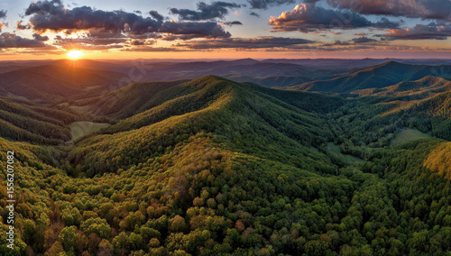 Panoramic sunset over rolling green hills