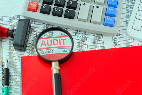 Принти на полотні A photo concept for Audit theme; A detailed report is placed under a magnifying