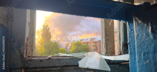 Urban street view with smoke through broken window