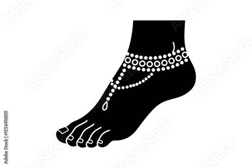 Silhouette of a foot wearing an ornate anklet design