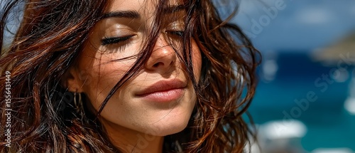 Woman with wavy hair by the sea
