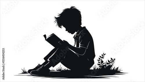A Silhouette of a boy reading a book