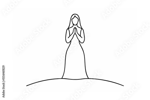 Woman praying in a long dress devotion faith