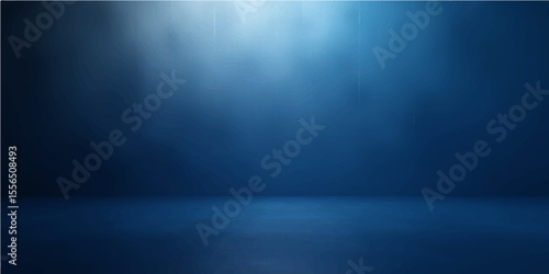 Blue spotlight shining on a dark metal wall stage with textured backdrop and empty space