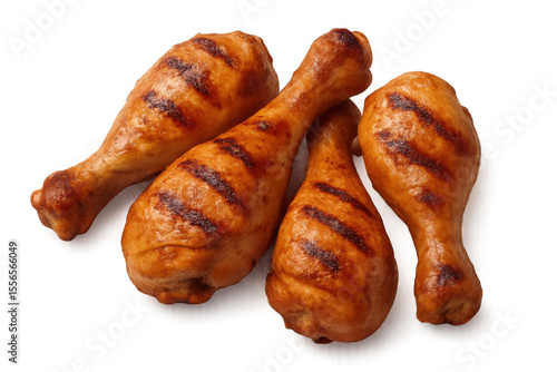 Roasted chicken drumsticks with dark grill marks, golden-brown skin, resting on transparent backdrop