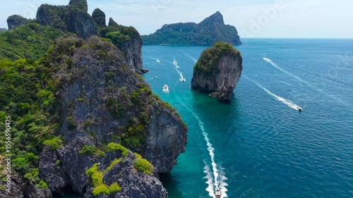 Flight along Phi Phi Don Island. Turquoise coast, popular Thai islands in Krabi province.