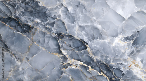 A close up shot of a blue and white marble surface with golden vein details