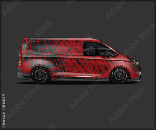 Custom Red Van with Black Abstract Graphics on a Dark Background