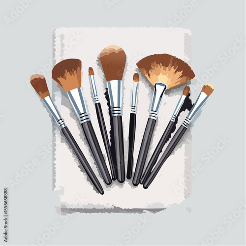 A makeup brush set arranged neatly on a towel
