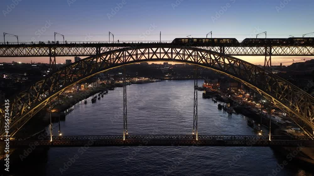 Sunset Dom Luis I Bridge In Porto Portugal. Aerial View Of Urban Railway Station With Buildings In Background. Building Town Sky Illumination Urban. Outside Panoramic. Porto Portugal. Sunset Dom Luis I Bridge In Porto Portugal. Aerial View Of Urban Railway Station With Buildings In Background. Building Town Sky Illumination Urban. Outside Panoramic. Porto Portugal.