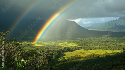Double rainbow over valley