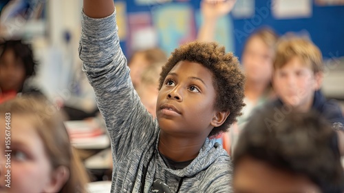 Student Raising Hand in Elementary School Classroom