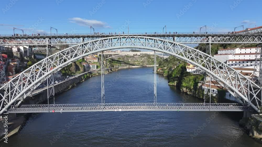 Luis I Bridge In Porto Portugal. Bridge Showcasing The Traffic Flowing Across In The City. Industry Landscape High Rise Building Beautiful. Industry Town. Porto Portugal. Luis I Bridge In Porto Portugal. Bridge Showcasing The Traffic Flowing Across In The City. Industry Landscape High Rise Building Beautiful. Industry Town. Porto Portugal.