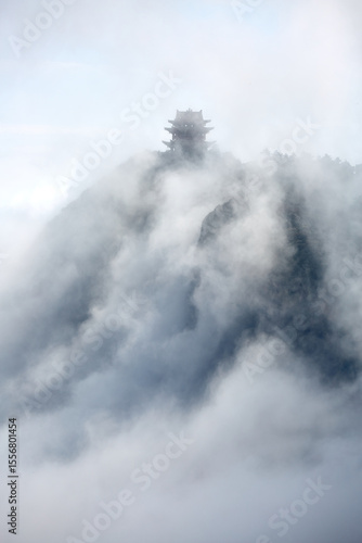 Fotografie The Wanfo Summit of Mount Emei in Sichuan, China, emerging from a sea of clouds