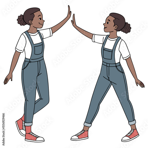 Two girls giving high five in denim overalls twins white t-shirt