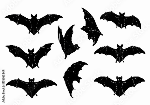 Set of black bat silhouettes in various flying poses isolated on a white background, perfect for Halloween or spooky designs.