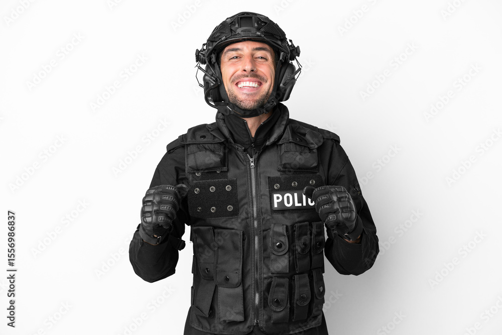 Naklejka premium SWAT caucasian man isolated on white background celebrating a victory in winner position