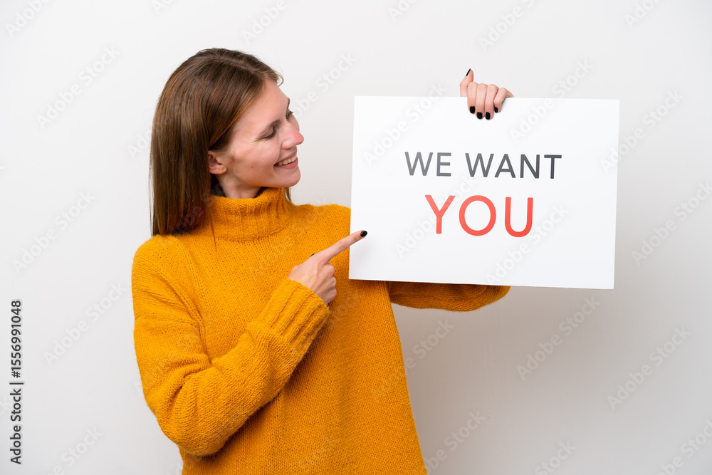 Young English woman isolated on white background holding We Want You board and pointing it Young English woman isolated on white background holding We Want You board and pointing it