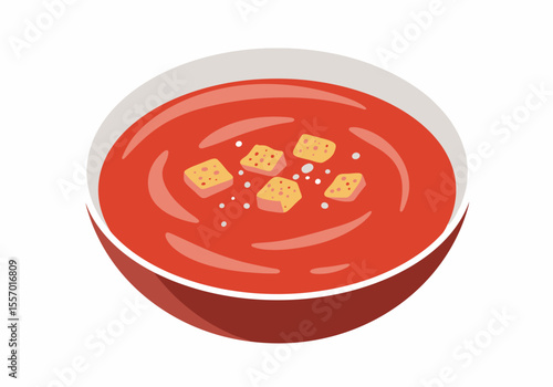 Red tomato soup in a bowl garnished with croutons and spices