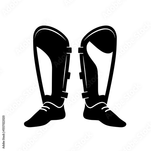 Shin Guards: Two black shin guards stand tall, a testament to sportsmanship and protection, designed to safeguard athletes on the field. 