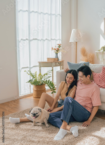 Asian family stay at home together with dog on holiday. Love couple lifestyle.