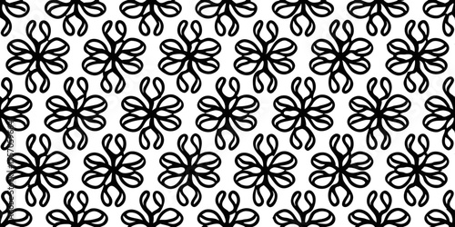 Elegance in Monochromatic Detail: A captivating black and white pattern of intricate floral motifs. It embodies a sense of refined style and classic design.