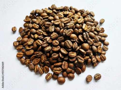 Close up arabica  coffee beans on white paper.