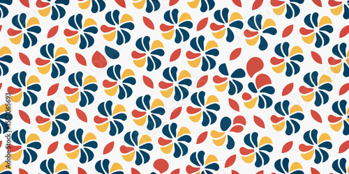 Colorful floral pattern: A vibrant and intricate repeating pattern of stylized flowers and leaves in a playful arrangement of colors. The image brings out the simple pleasures of elegance.