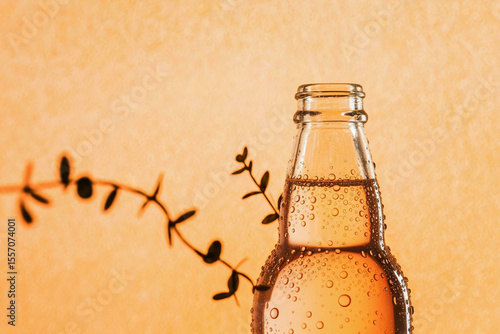 bottle of chilled orange soda closeup