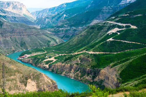 Picturesque landscape of Sulak Canyon with serpentine road and winding mountain river in the mountains of North Caucasus Dagestan. Russia