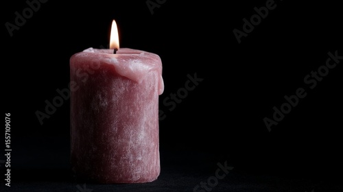 Pensive crimson candle flickers in shadowed silence, whispering tales of Samhain and hygge warmth in solemn reverie