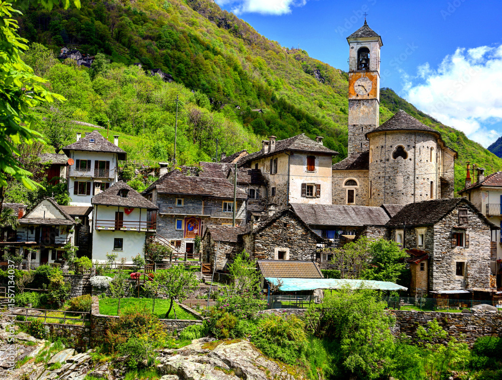 Fototapeta premium alpine landscape of Lavertezzo village with Roman Bridge and Madonna degli Angeli Parish Church, Switzerland