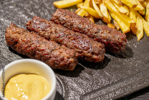 Photos details of tasty romanian mici with fries