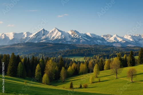 Fototapeta Naklejka Na Ścianę i Meble -  Stunning morning vista of the majestic mountain range seen from a quaint village