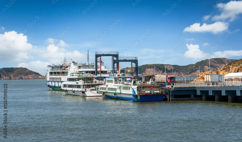 Fototapeta premium Scenic Harbor View with Ferries Docked at a Picturesque Pier
